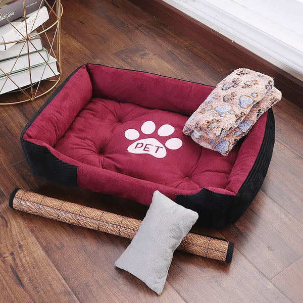 Pets-Shop: A cozy pet bed with cushions and a paw print, accompanied by toys and a blanket on a wooden floor. Shopets-Amazon.