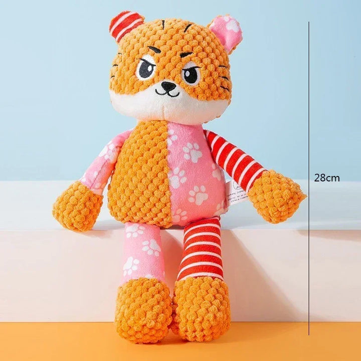 Pets-Shop. Orange plush toy cat with striped limbs and pink vest against blue-yellow background. 28cm size reference. Shopets-Amazon.