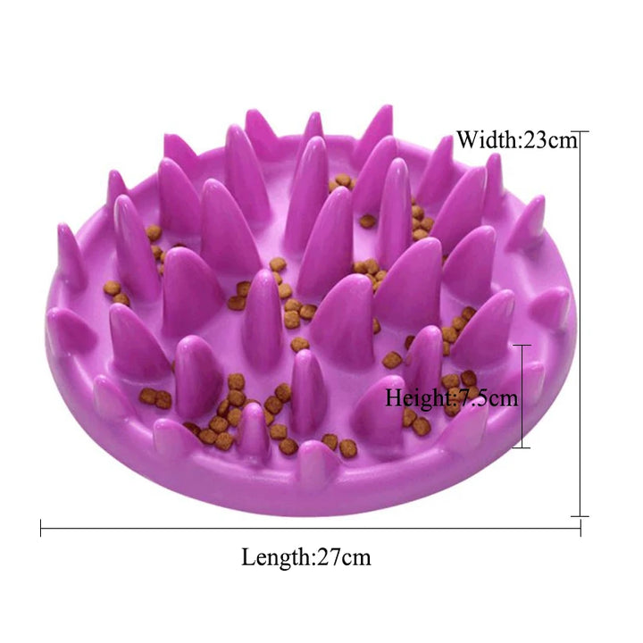 Pets-Shop. A purple slow feeder dog bowl with scattered kibble and dimension labels: Length: 27cm, Width: 23cm, Height: 5cm. Shopets-Amazon.