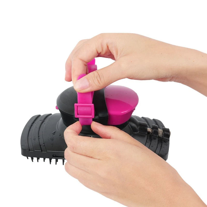 Pets-ShopHands demonstrating a black and pink pet grooming brush against a white background.Shopets-Amazon